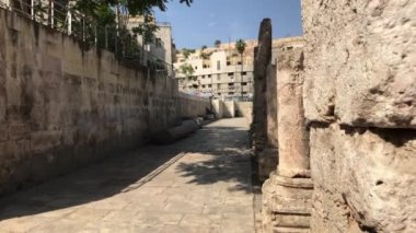 Amman, Jordan - October 20, 2019: Roman Amphitheater tourists walk through the ruins part 1