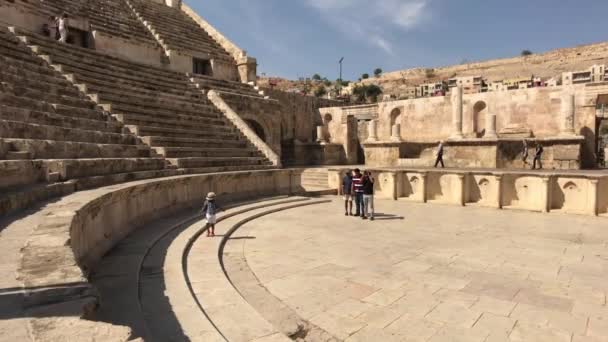 Amman, Jordan - October 20, 2019: Roman Amphitheater tourists walk through the ruins part 10 — Stockvideo