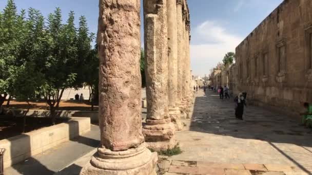 Amman, Jordan - October 20, 2019: Roman Amphitheater tourists walk through the ruins part 2 — Stock video