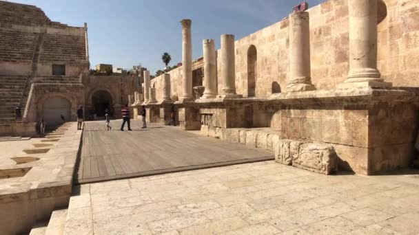 Amman, Jordan - October 20, 2019: Roman Amphitheater tourists walk through the ruins part 8 — Stock video