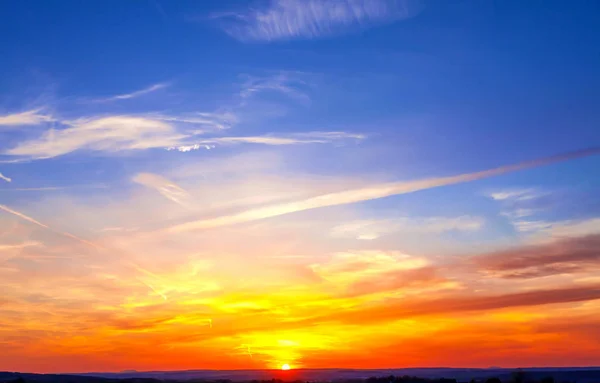 Bright orange and yellow colors sunset sky — Stock Photo, Image