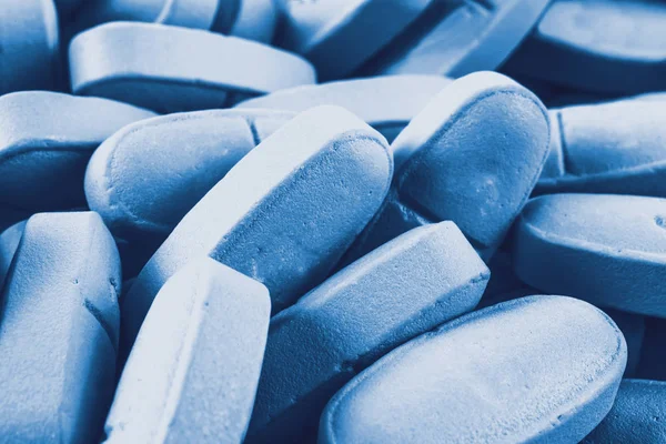 Modré pilulky jako pozadí — Stock fotografie