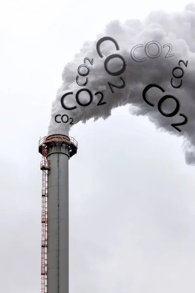 Smoke of chimney writing CO2 in the sky
