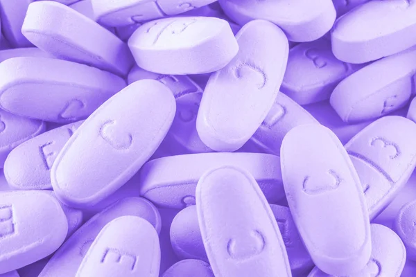 Fialová pilulky jako pozadí — Stock fotografie