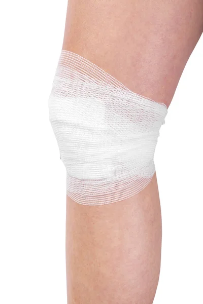 Wounded leg with bandage isolated on white background