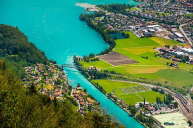 The beautiful Interlaken valley and Thunersee river clipart