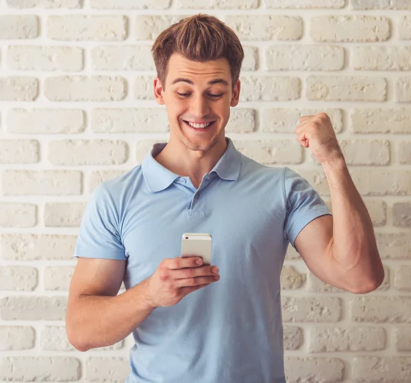 Handsome guy with gadget — Stock Photo, Image