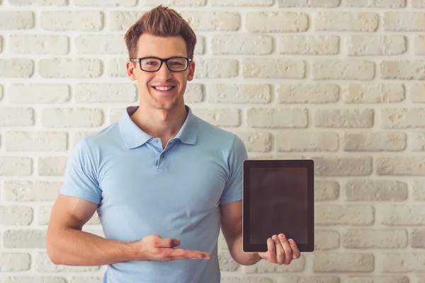 Handsome guy with gadget — Stock Photo, Image