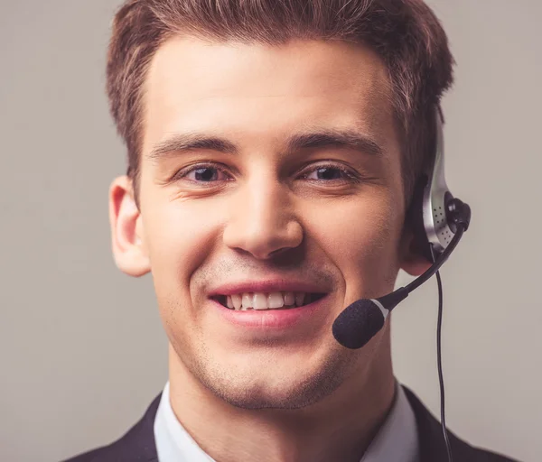 Handsome young businessman with gadget — Stock Photo, Image