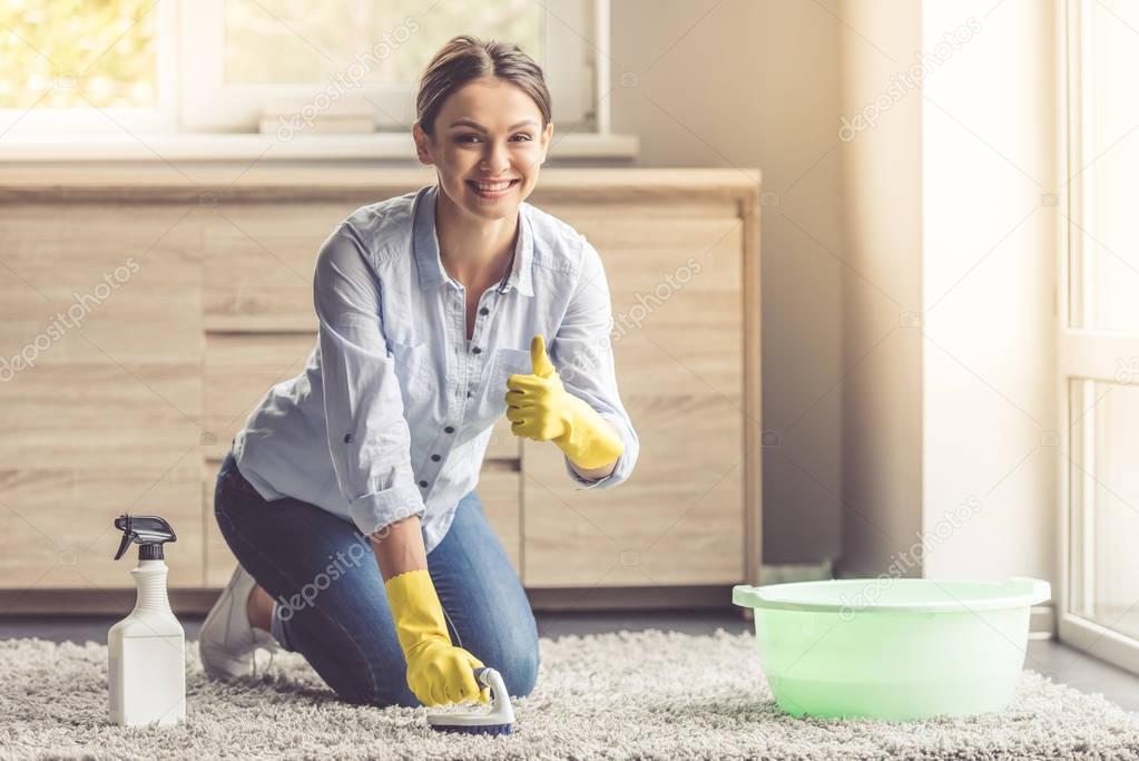 Young girl cleaning house curious Young girl cleaning house