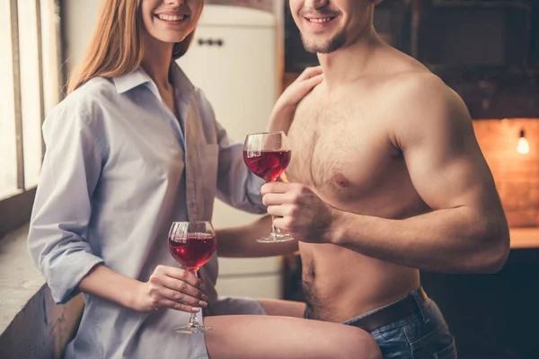 Beautiful couple in the kitchen — Stock Photo, Image