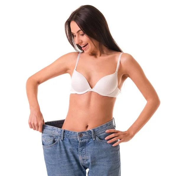 Flicka visar viktminskning — Stockfoto