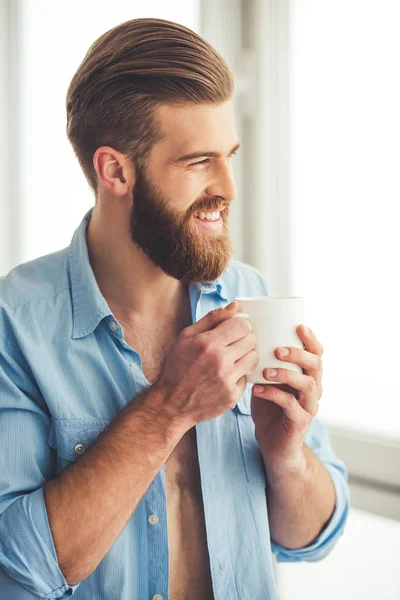 Handsome bearded man at home — Stock Photo, Image