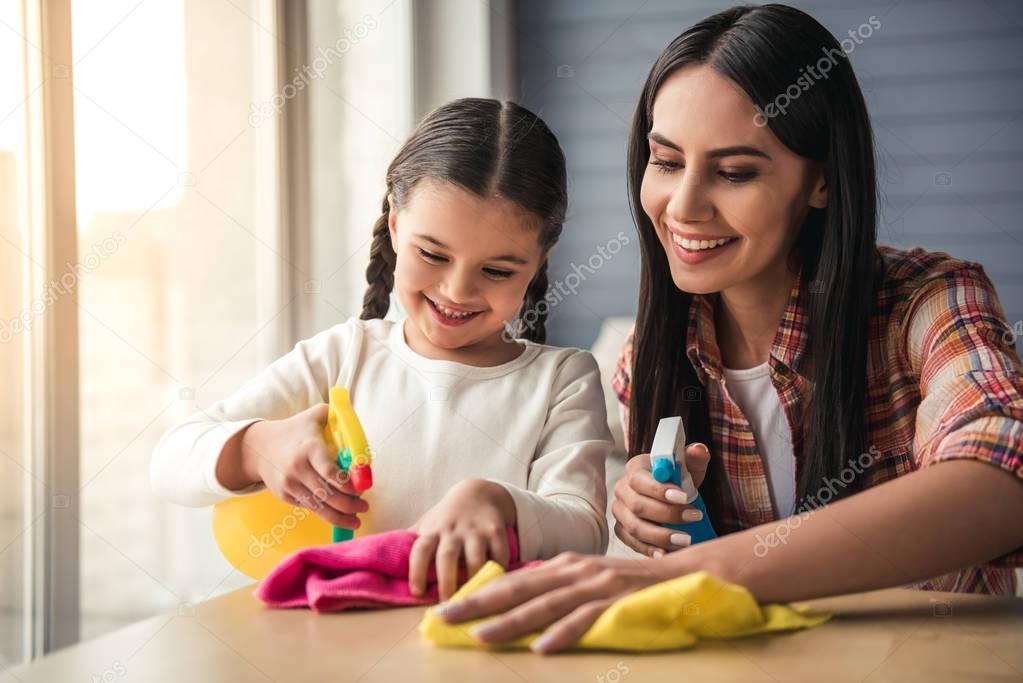 Mom and daughter cleaning house