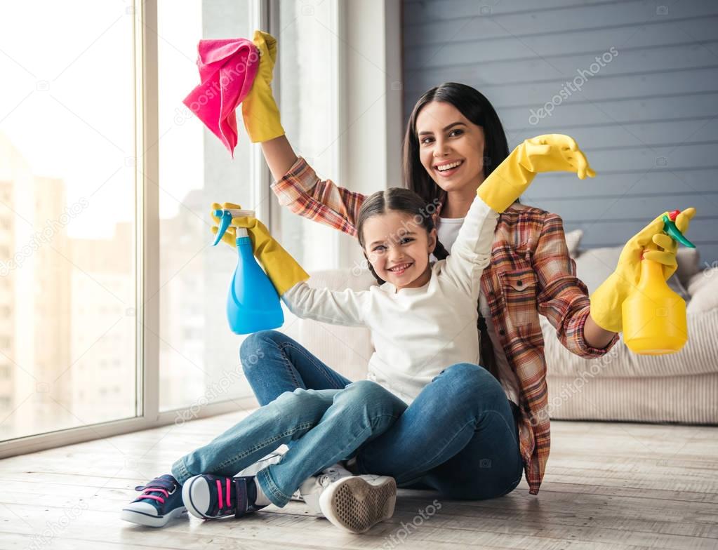 Mom and daughter cleaning house