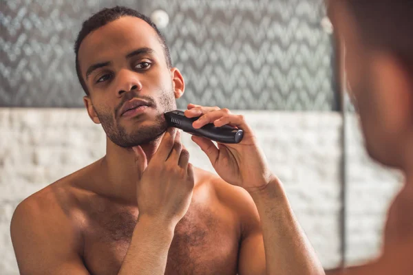 Afro American man in bathroom — Stock Photo, Image