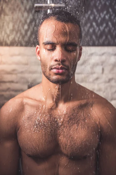 Afro American man taking shower — Stock Photo, Image