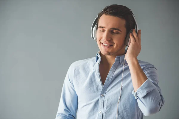 Handsome guy in headphones — Stock Photo, Image