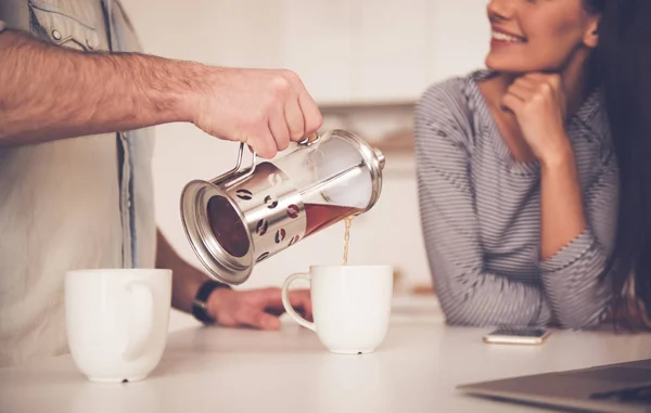 Beautiful couple in kitchen — Stock Photo, Image