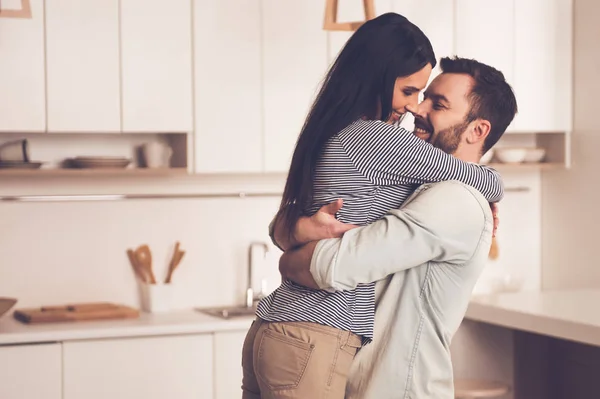 Beautiful couple in kitchen — Stock Photo, Image