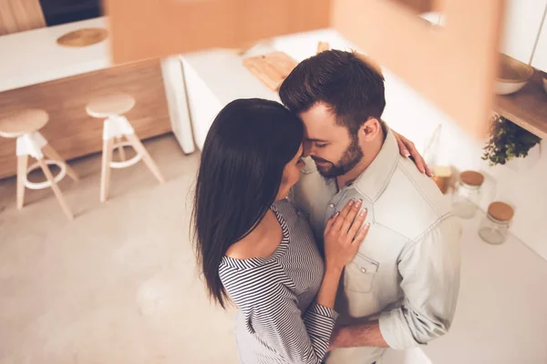 Beautiful couple in kitchen — Stock Photo, Image