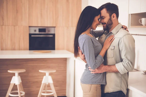 Beautiful couple in kitchen — Stock Photo, Image