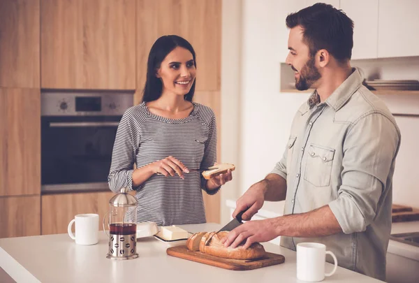 Beautiful couple in kitchen — Stock Photo, Image