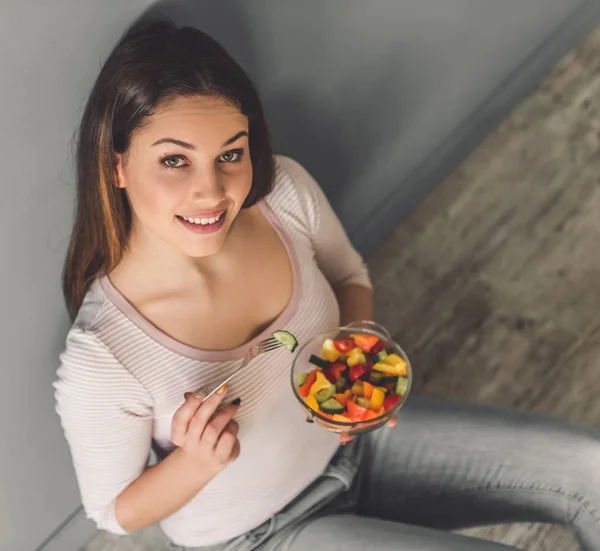 Attractive girl with food — Stock Photo, Image