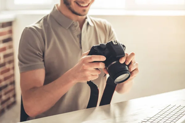 Handsome young photographer — Stock Photo, Image