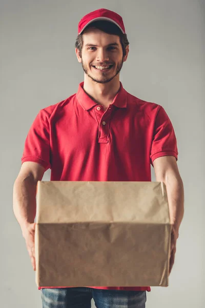Handsome young delivery worker — Stock Photo, Image