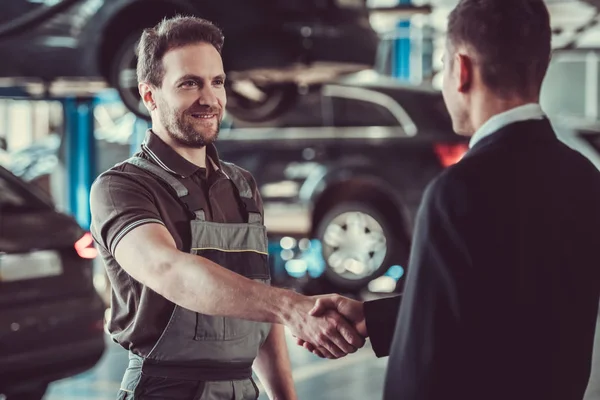 Handsome mechanic and businessman — Stock Photo, Image