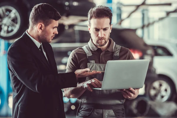 Handsome mechanic and businessman — Stock Photo, Image