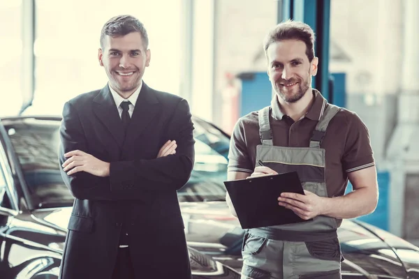 Handsome mechanic and businessman — Stock Photo, Image