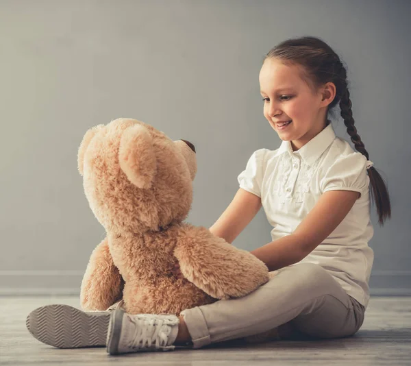 Little girl with toy — Stock Photo, Image