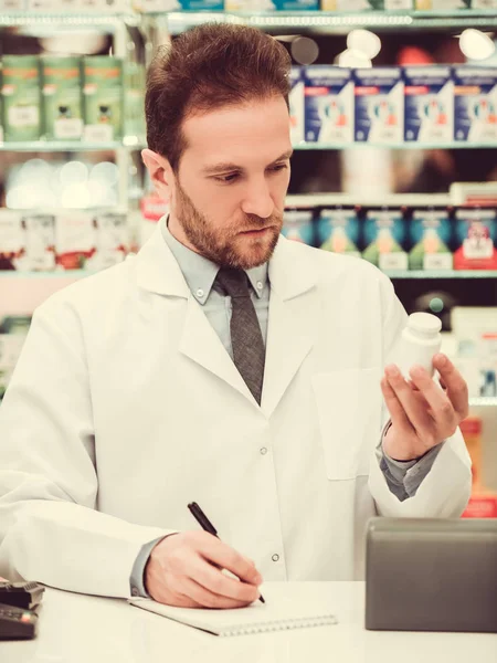 Handsome pharmacist at work — Stock Photo, Image