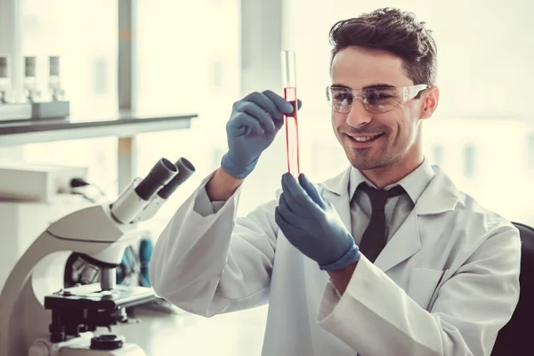 Handsome doctor in laboratory — Stock Photo, Image