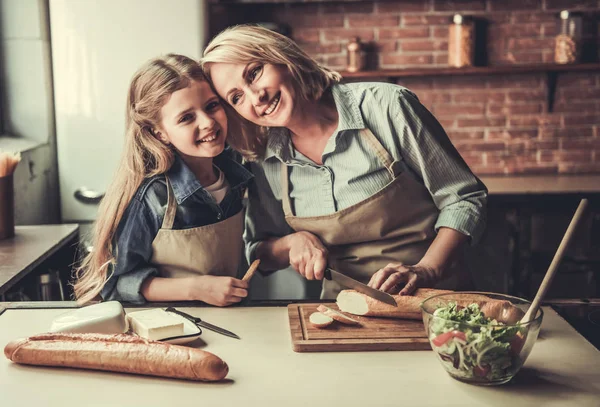 Grandma and granddaughter in kitchen