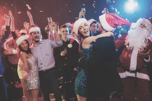 Young Couple Dancing Embracing Have Santa Claus Caps Backdrop Friends — Stock Photo, Image