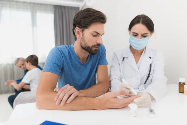 Nurse Takes Blood Sample Man Scarifier Nurse Sitting Mask Gloves — Stock fotografie