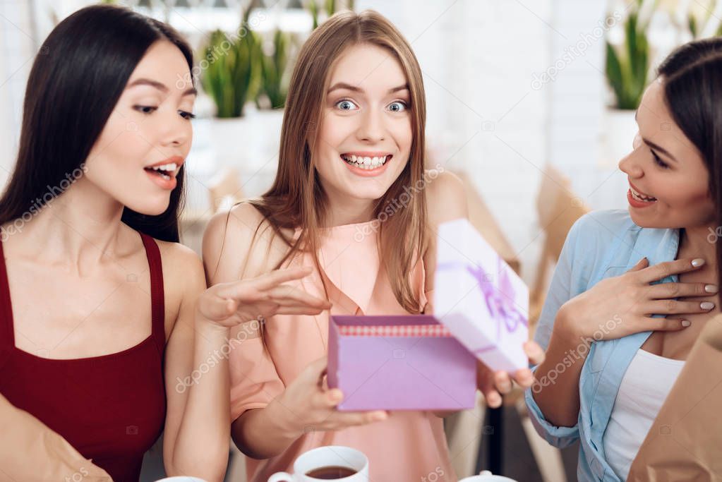 Three girls celebrate the holiday on March 8.