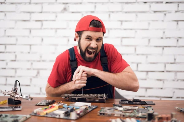 The master of electronics repair is nervous and angry.