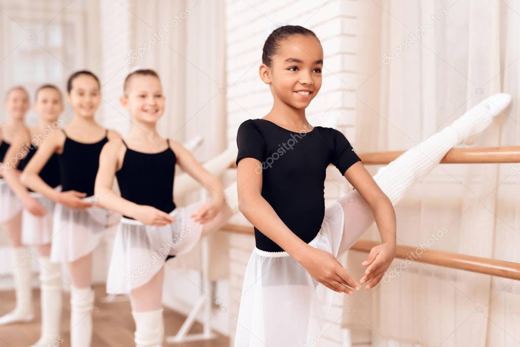 Young ballerinas rehearsing in the ballet class.