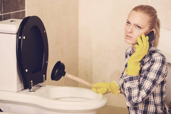 The plumber repairs the pipes. Male specialist plumber repairs.