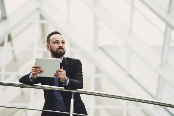 Happy young business man with tablet at work in modern office — Stok Foto