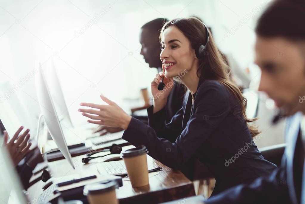 Caucasian girl looks at work in the call center.