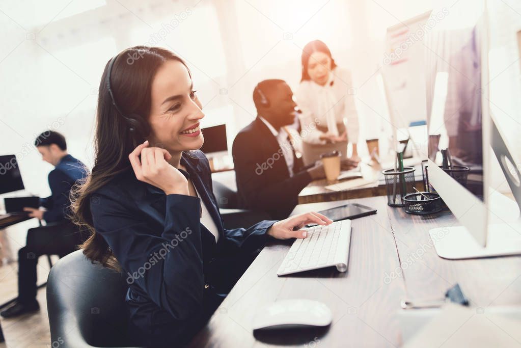 Two girls who work as operators in the call center talk to a black guy.