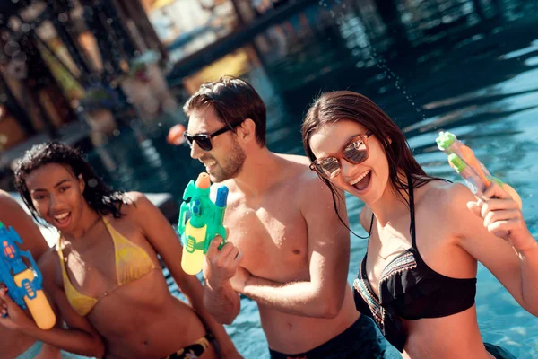 Happy People Water Guns Have Fun Pool Carefree Spending Time —  Fotos de Stock