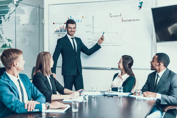 Young Successful Businessman Points Board Showing Company Development Schedule Business — Stock Photo, Image