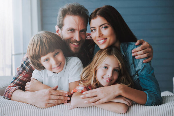 Portrait of happy parents with lovely children. Full healthy families concept.
