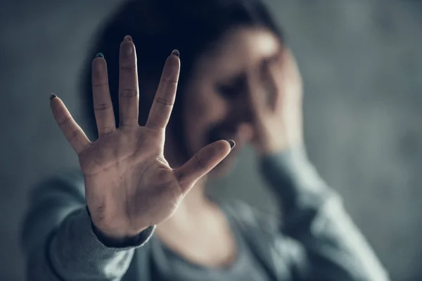 Oppressed woman shows by hand sign stop. — Stock Photo, Image